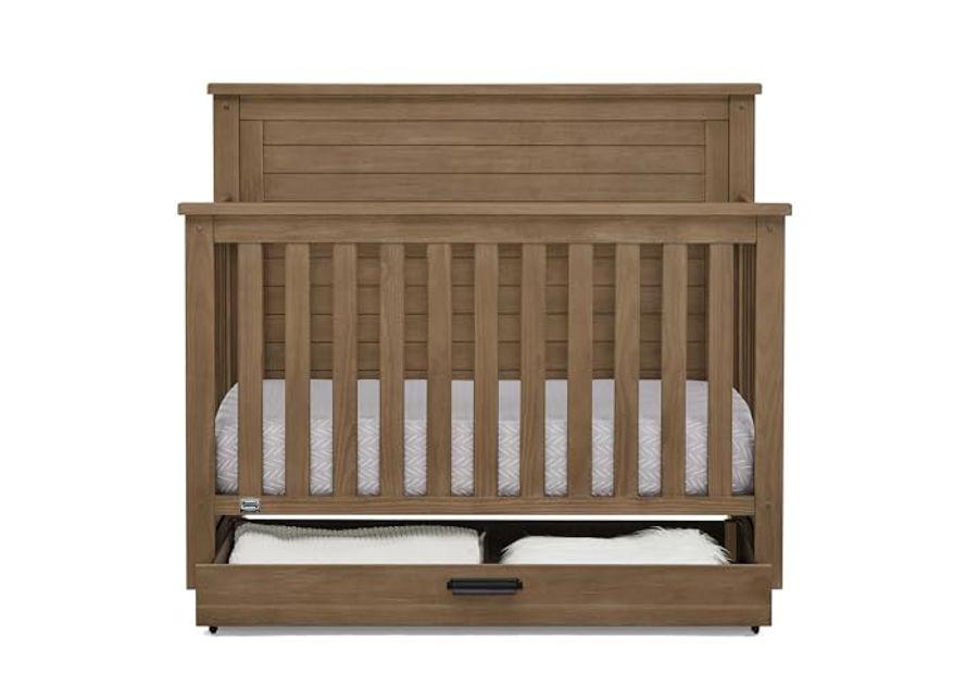 Delta Children Simmons Kids Caden 6-in-1 Convertible Crib with Trundle Drawer, Greenguard Gold Certified, Aged Oak