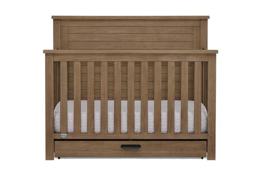 Delta Children Simmons Kids Caden 6-in-1 Convertible Crib with Trundle Drawer, Greenguard Gold Certified, Aged Oak