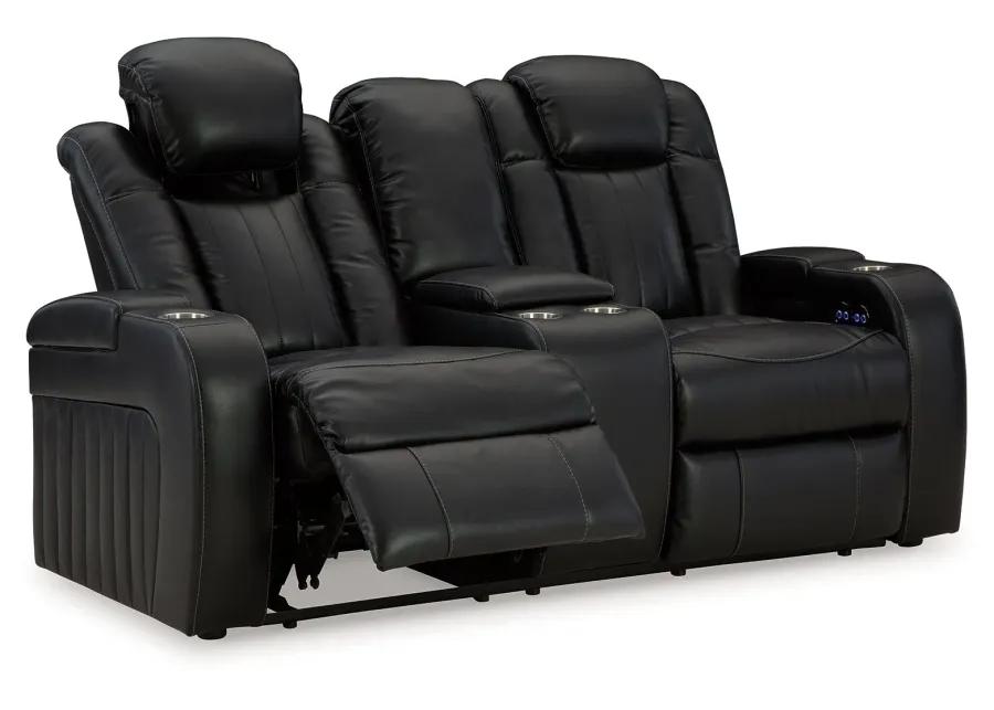 Caveman Den - Midnight - Power Reclining Loveseat With Console/ Adj Hdrst