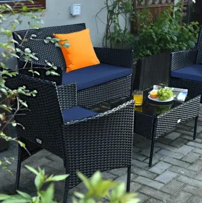 4 Pieces Patio Rattan Cushioned Sofa Set with Tempered Glass Coffee Table-Navy