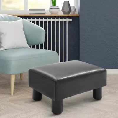 HOMCOM Ottoman Foot Rest, Small Foot Stool with Faux Leather Upholstery, Rectangular Ottoman Footrest with Padded Foam Seat and Plastic Legs, Bright Black