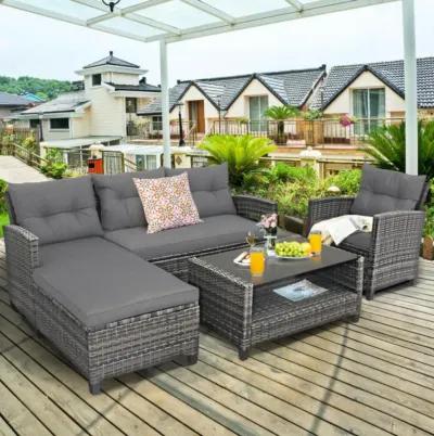 Hivvago 4 Pieces Patio Rattan Furniture Set with Cushion and Table Shelf