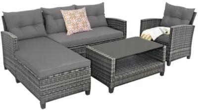 Hivvago 4 Pieces Patio Rattan Furniture Set with Cushion and Table Shelf