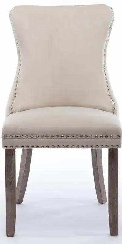 2 Beige Wingback Dining Chairs with Nailhead Trim & Wood Legs