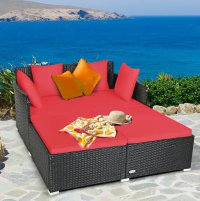 Spacious Outdoor Rattan Daybed with Upholstered Cushions and Pillows