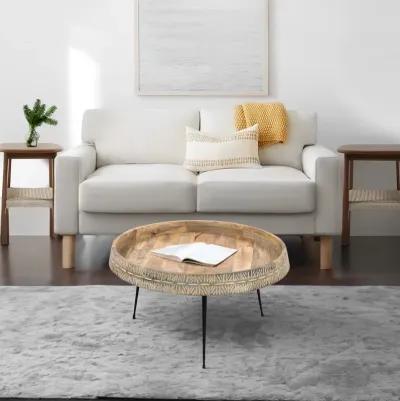 29 Inch Modern Handcrafted Round Coffee Table, Natural Brown Wood Top with Carved Edge, Black Iron Legs-Benzara