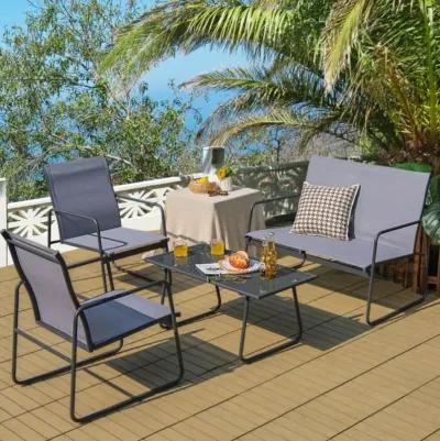 Hivvago 4 Pieces of Metal Patio Furniture Chat Set with Tempered Glass Coffee Table