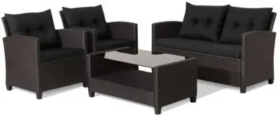 Hivvago 4 Pieces Patio Rattan Furniture Set with Tempered Glass Coffee Table