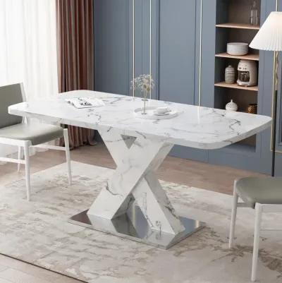 White marble dining table with X-shaped metal legs