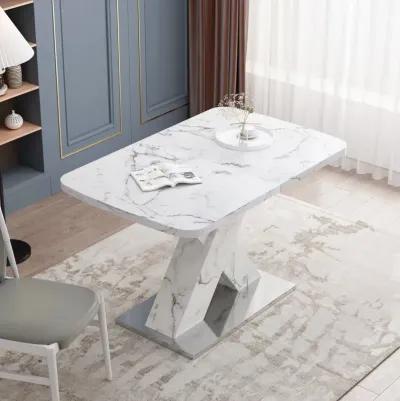 White marble dining table with X-shaped metal legs