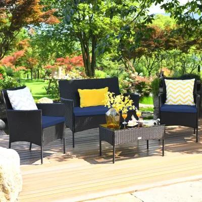 4 Pieces Patio Rattan Cushioned Sofa Set with Tempered Glass Coffee Table-Navy & Off White