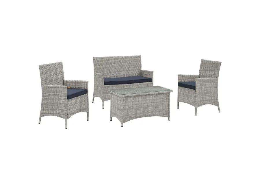 Bridge Wicker Rattan Outdoor Patio Sectional Sofa Set - Gray Distressed Chic Style. Sturdy Aluminum Frame, Tempered Glass Coffee Table. All-Weather Cushions. Perfect for Contemporary Outdoor Spaces. Includes Loveseat, Armchairs, and Coffee Table.