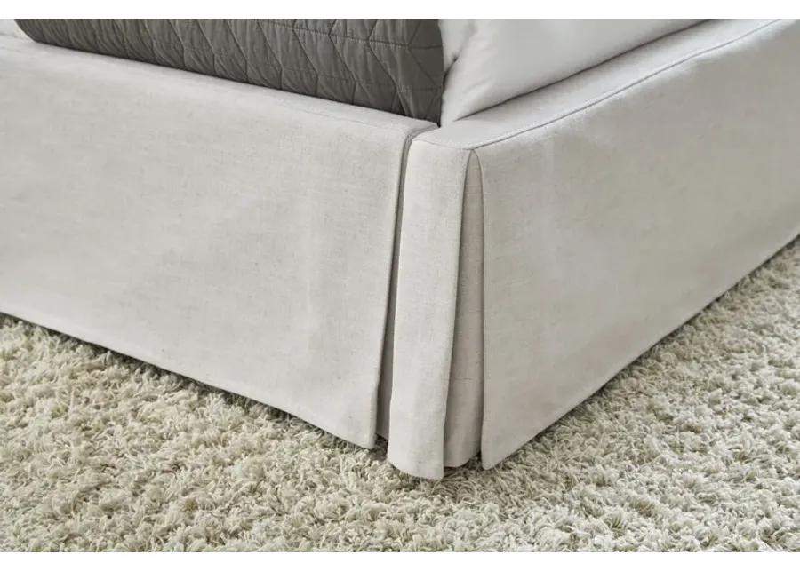 Hera King-Size Upholstered Skirted Panel Bed in Oatmeal