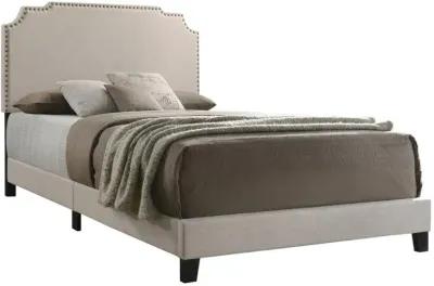 Acle Upholstered Nailhead Eastern King Bed Beige