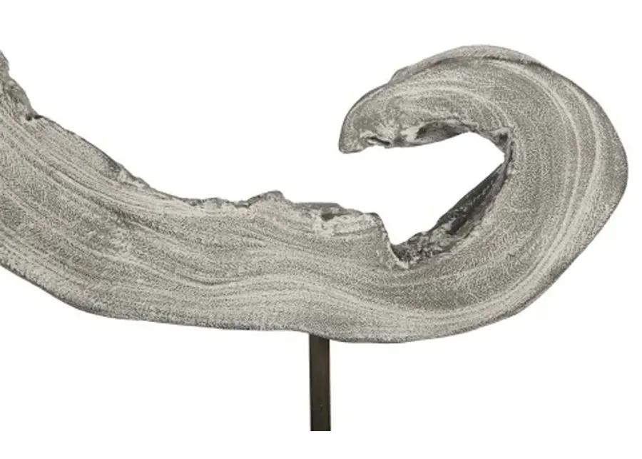 creature sculpture on stand, gray stone