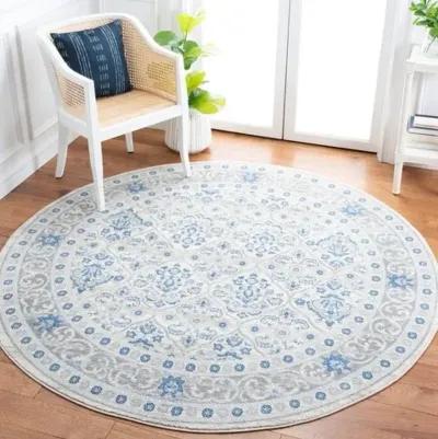 Brentwood 870 Ivory / Blue 6'-7" X 6'-7" Round Round Powerloomed Rug