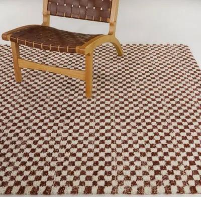 Mann 5 x 7 Checkered Orange Area Rug