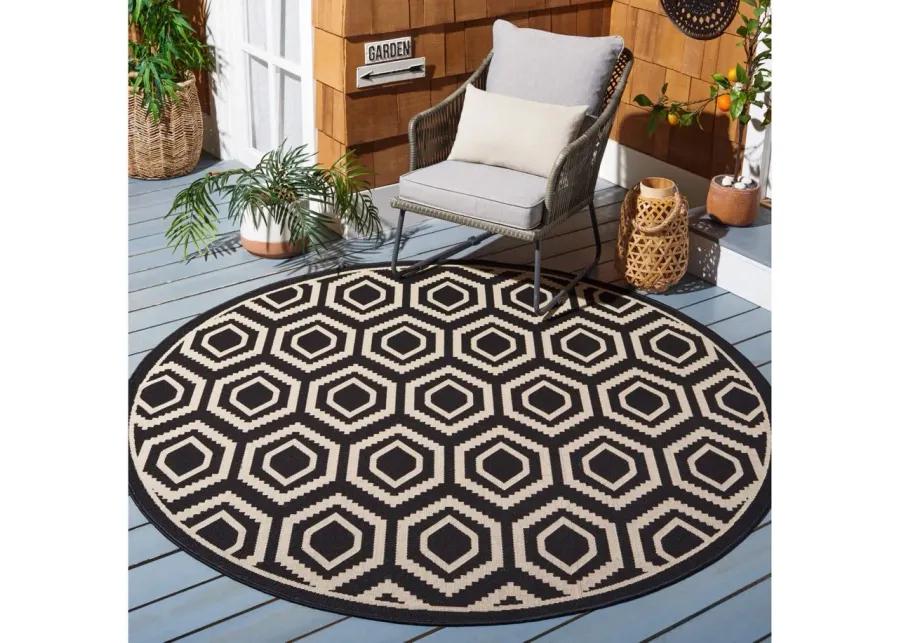 Courtyard Diamonds Indoor/Outdoor Area Rug Round in Black & Beige by Safavieh