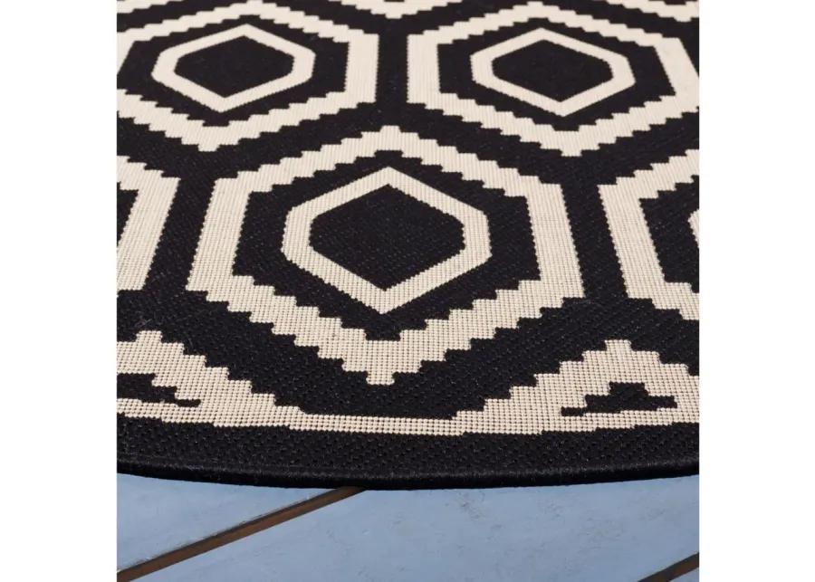 Courtyard Diamonds Indoor/Outdoor Area Rug Round in Black & Beige by Safavieh