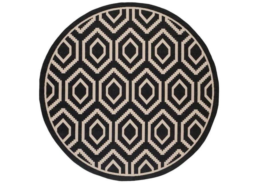 Courtyard Diamonds Indoor/Outdoor Area Rug Round in Black & Beige by Safavieh