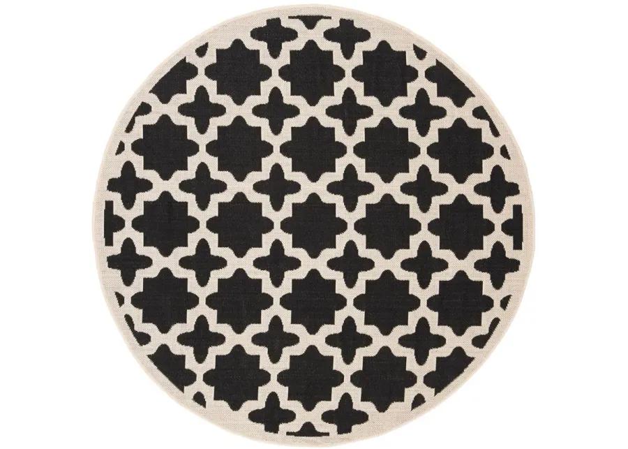 Courtyard Tile Indoor/Outdoor Area Rug Round in Black & Beige by Safavieh