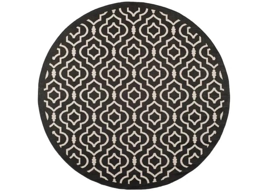 Courtyard Key Indoor/Outdoor Area Rug Round in Black & Beige by Safavieh