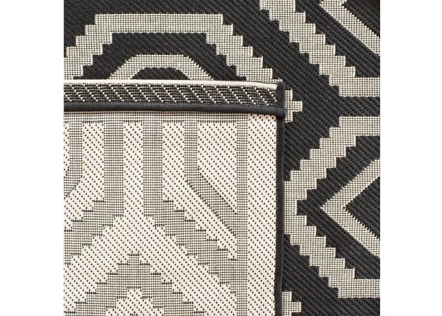 Courtyard Diamonds Indoor/Outdoor Area Rug in Black & Beige by Safavieh