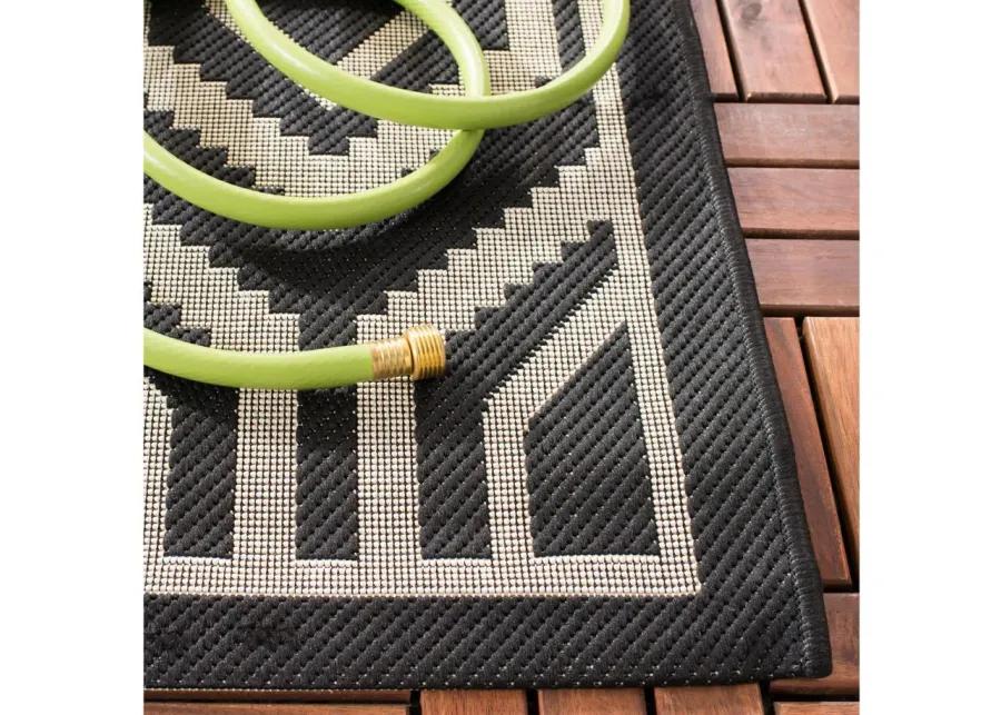 Courtyard Diamonds Indoor/Outdoor Area Rug in Black & Beige by Safavieh