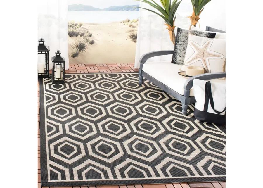 Courtyard Diamonds Indoor/Outdoor Area Rug in Black & Beige by Safavieh